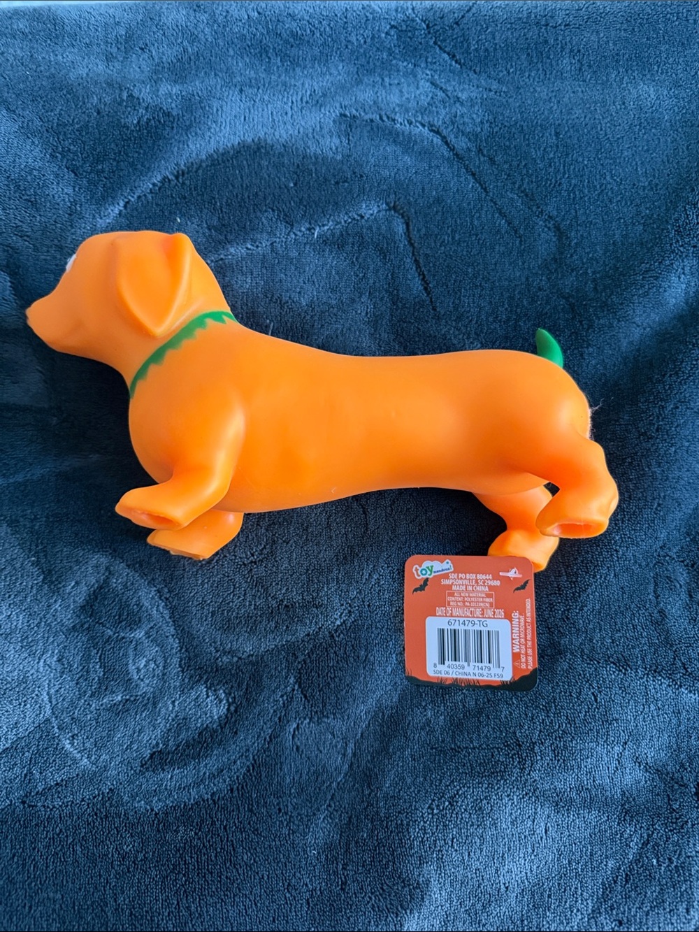 Toymendous Squeezy Orange Dachshund Toy dressed as pumpkin costume Halloween